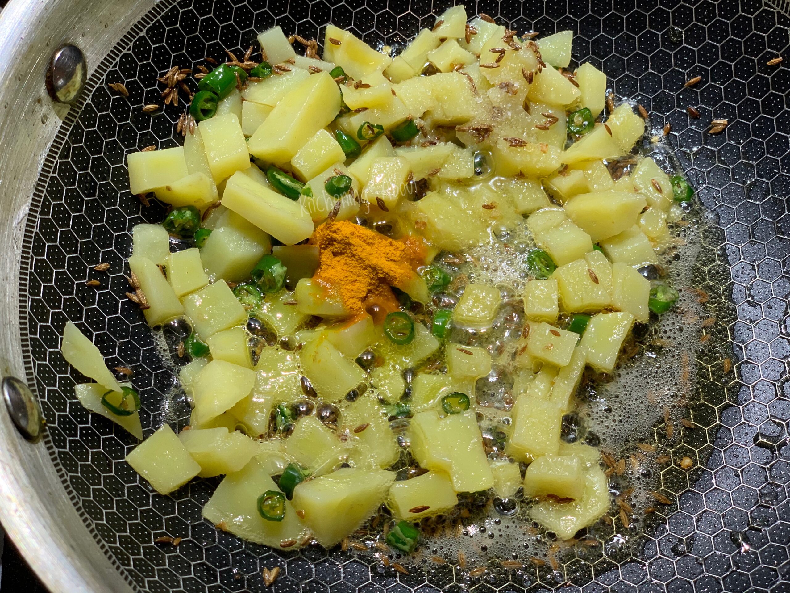 Add potatoes and spices